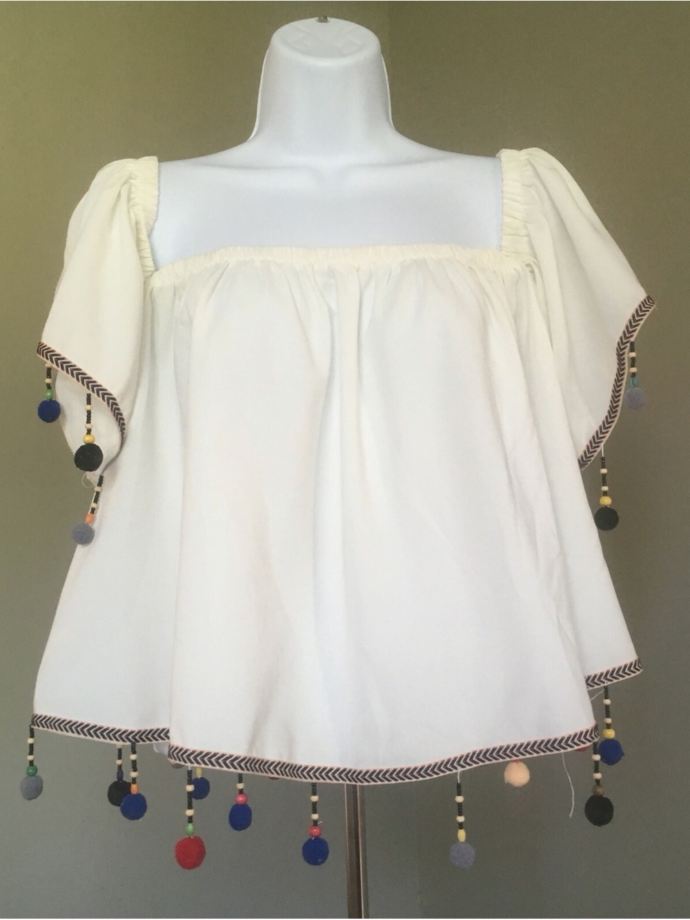 Hot & Delicious Ivory Pom Pom top with elastic around the shoulders